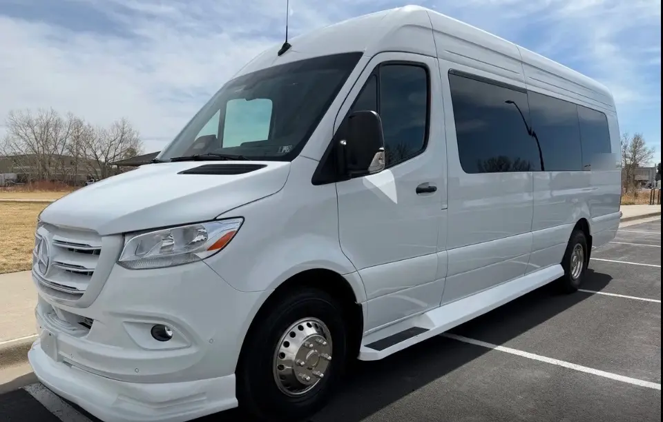 Berthoud 16 passenger white Sprinter limo bus
